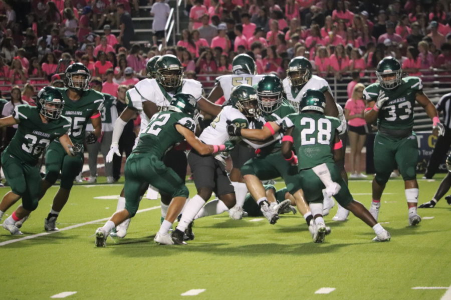 The Indian defense makes a stop in the Pink Out loss to DeSoto.