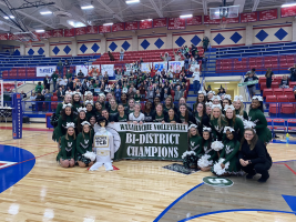 Varsity volleyball and cheerleaders celebrate win