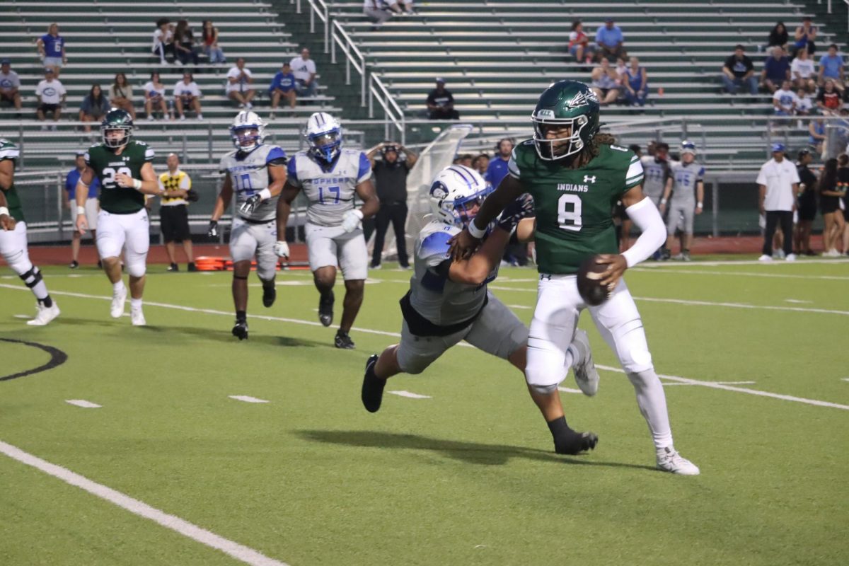 Senior quarterback Ramon McKinney avoids the defender against Grand Prairie. McKinney has thrown for almost 600 yards and rushed for that many as well while leading the team with 11 touchdowns. 